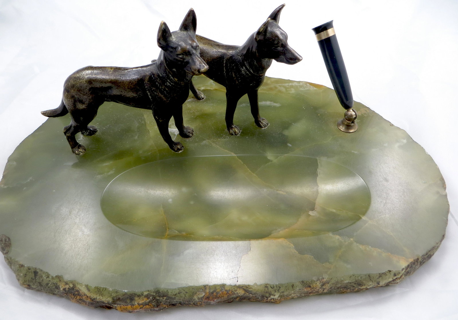 SHEAFFER GERMAN SHEPHERD PEN BASE: Green onyx base with rough hewn edge, single pen holder; cast metal German Shepherd dogs; felted bottom; retains partial label; L-12", EX
