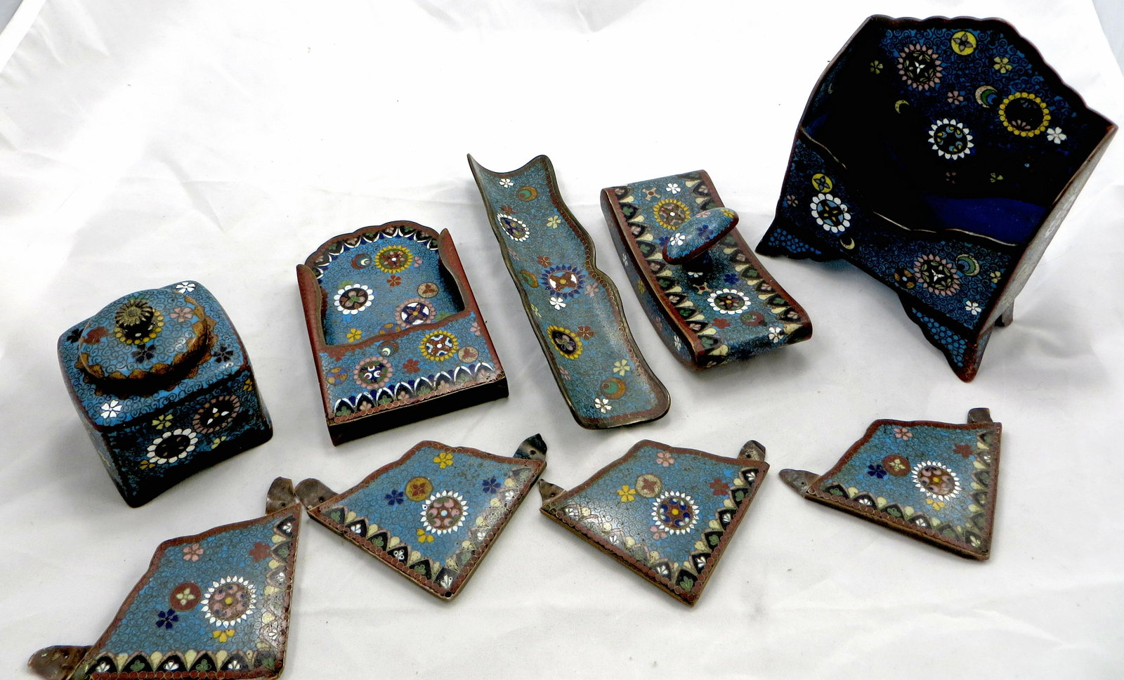 (6) PIECE CLOISONNE DESK SET: Floral and medallion motif; blue ground; includes: pen holder, blotter, (4) desk blotter corners, letter holder, stamp holder, and lidded inkwell; inkwell lacking insert; very minor enamel losses, mos
