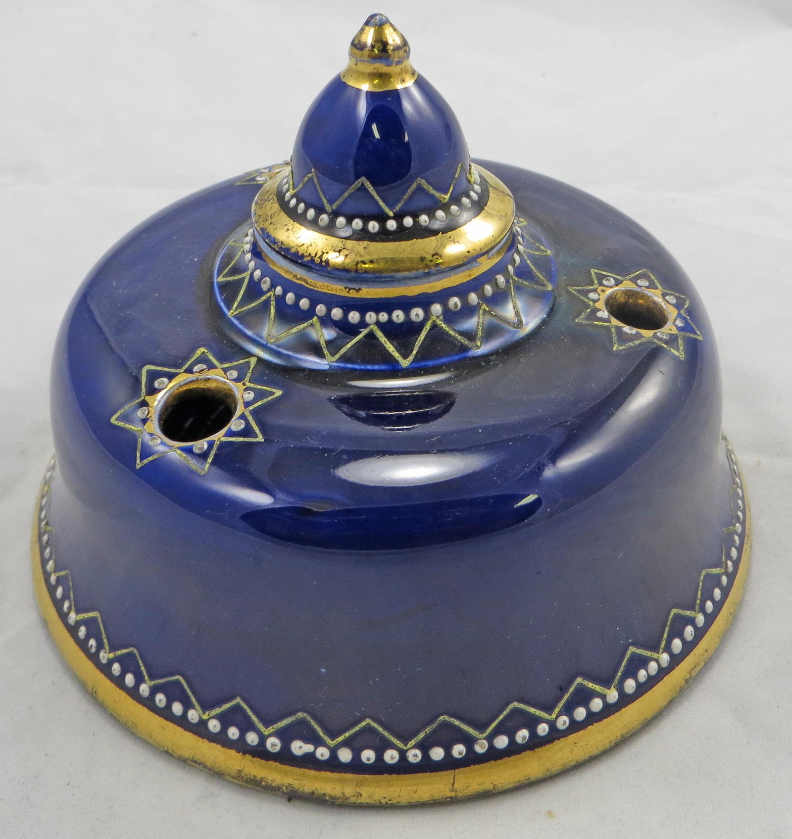 COBALT PORCELAIN INKWELL: Late 1800's; likely German; white beaded and gilt painted decoration; loose matching lid has been repaired with inpainted edge chips; gilt rubbing and minor losses on white beads; Dia.-4 3/4", F-G