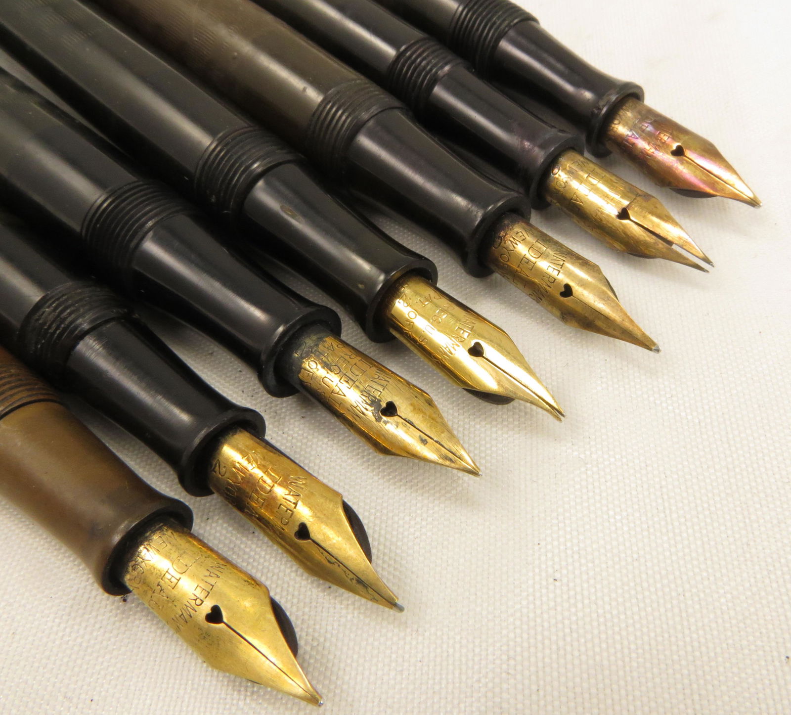 (7) WATERMAN'S FOUNTAIN PENS: (5) with missing caps, (1) with missing clip; nibs: (1) Ideal 2, (1) Ideal NY, pat. off, (2) USA, Ideal Reg. Pat Off; (1) Ideal NY 2; (2) Ideal NY; great for parts; longest L-5 1/4", F-G