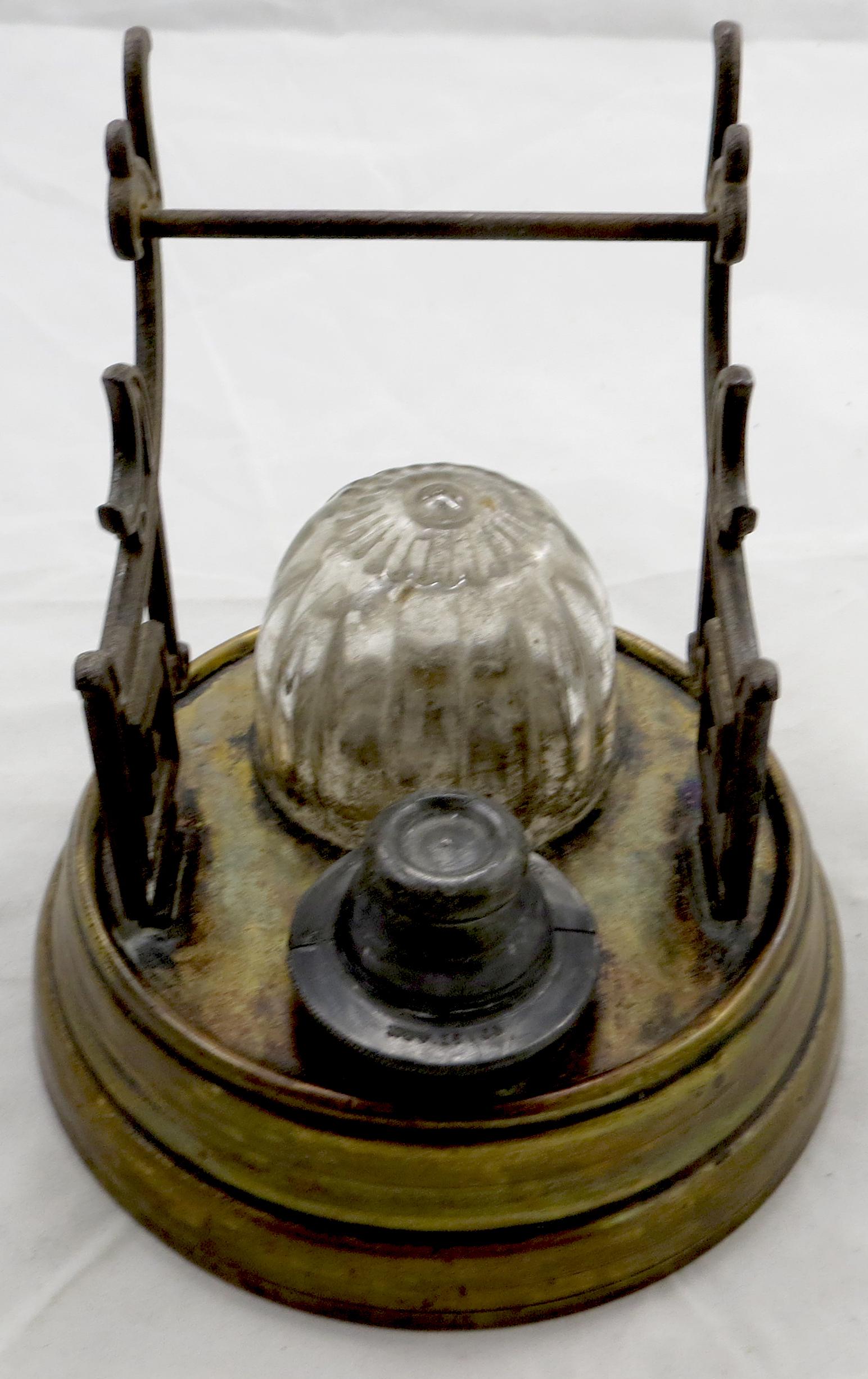 EARLY GRAVITY FED INKWELL STAND: Rubbed glasss dome, (3) pen holder; hinged metal inkwell lid; marked but hard to read; patent (possibly) June 4, 1901; normal wear and patina for age; H-5 1/2", G-VG