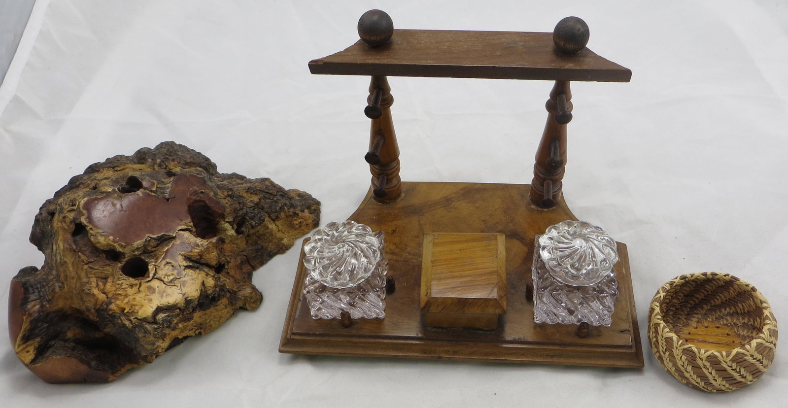 (3) PIECES - BURLED WOOD DESK SETS & BASKET: (1) desk set: includes (2) crystal inkwells, wooden stamp box which holds (3) pens, a few very small wood chips and scuffs; (1) burled wood pen holder: stamped on bottom, Adirondack Wood Emporium NY; 