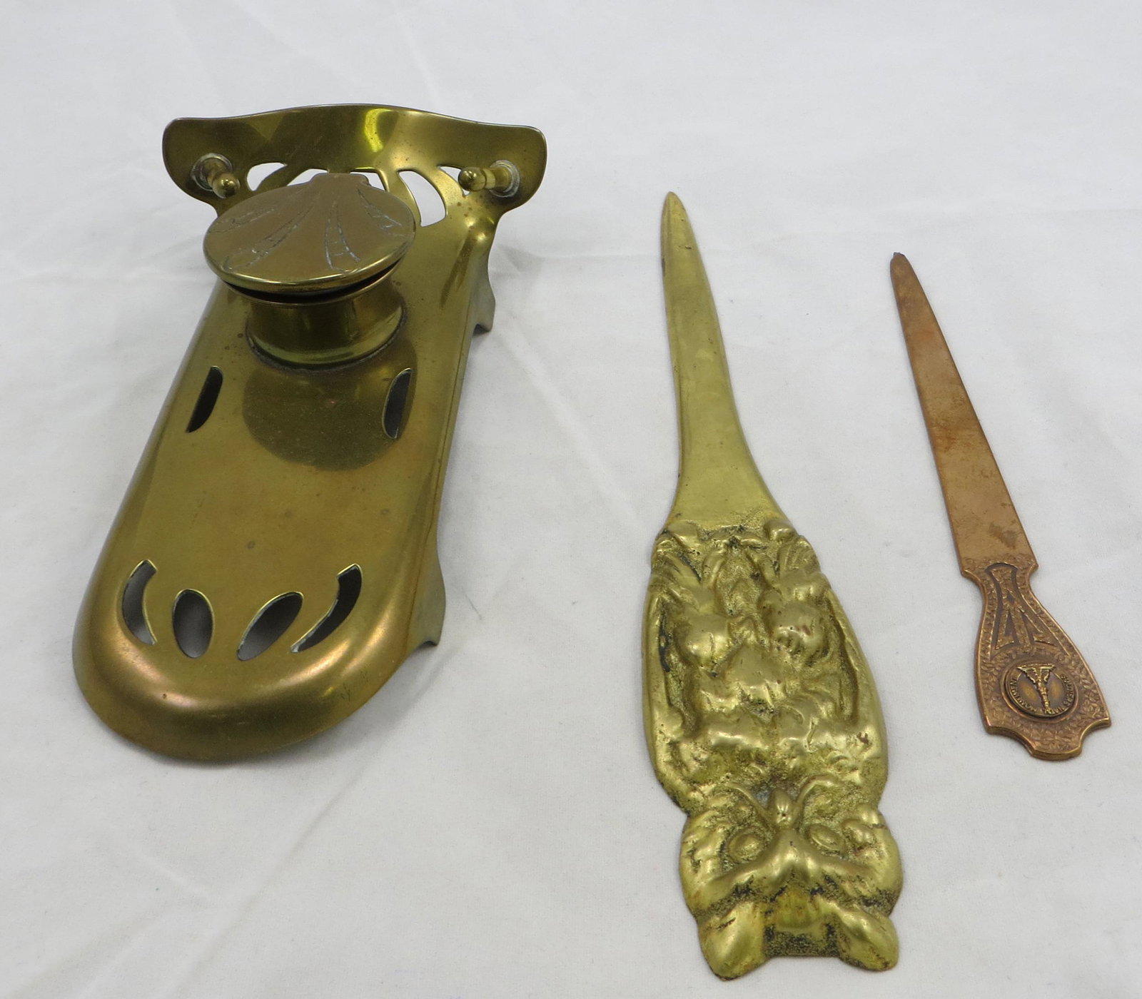 VINTAGE INKWELL & LETTER OPENERS: (1) brass inkwell, stamped: D.R.G.M.A. Ges Gesch; original porcelain insert, rim chip; (1) brass figural relef owl letter opener; (1) copper soldiers National Monument letter opener; longest L-8", G-V