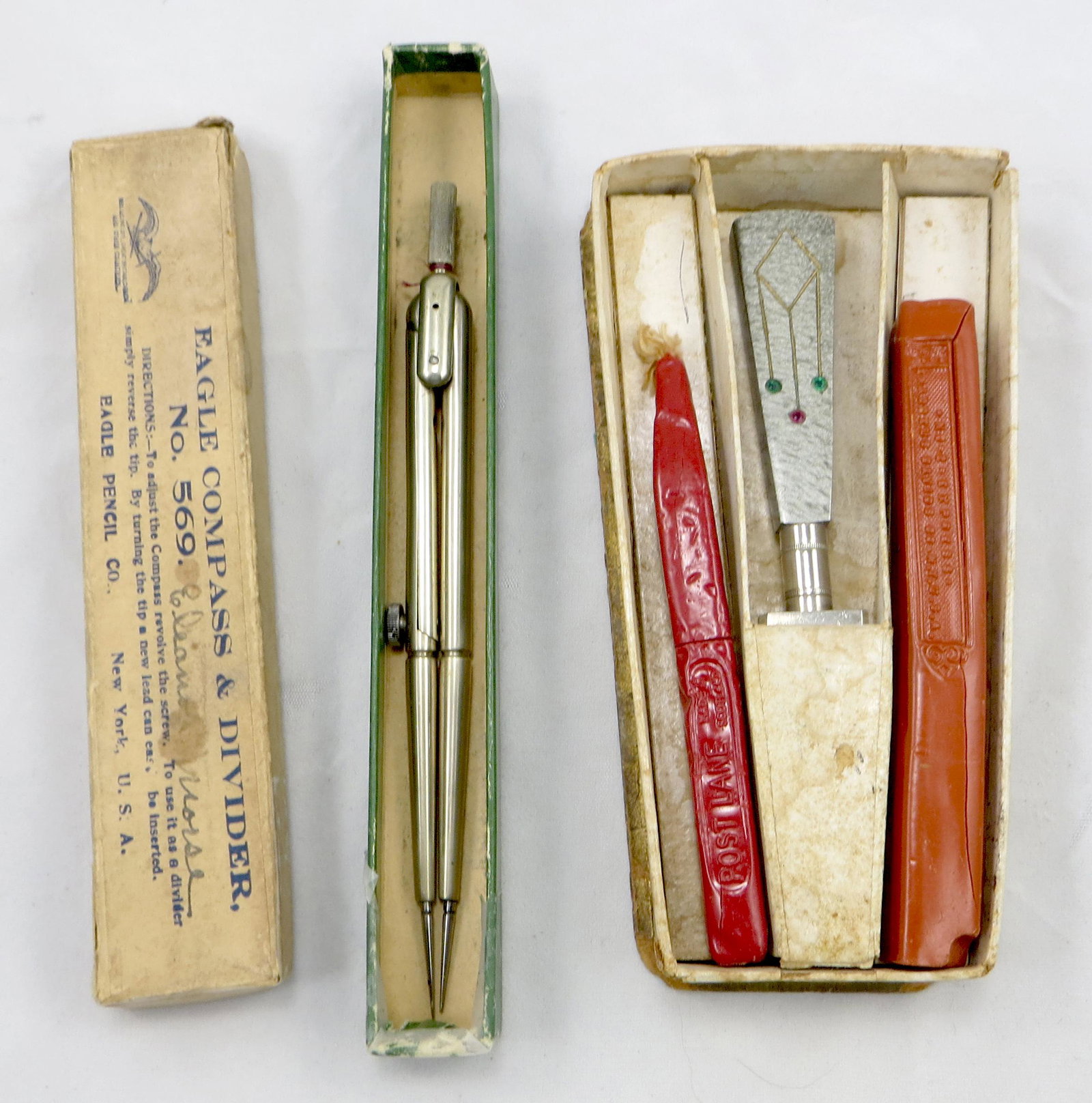 WAX SEAL SET, (2) BOXED COMPASSES: Includes: (1) Art Deco desk seal with wax candles in original fitted box base (no lid); marked Germany; pearlized jeweled haft, chrome seal with no matrix; box L-5 1/2"; (1) Eagle Compass and Divder #