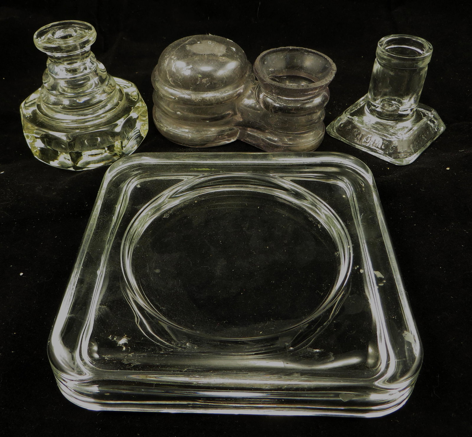 (4) GLASS INKWELLS, PEN HOLDERS, ETC.: (1) Schillings gravity feed inkwell - dome, rim chips and roughness; (1) Sanfords fountain pen and inks holder; (1) square base; (1) octagonal glass pen holder; longest L-5", G-VG