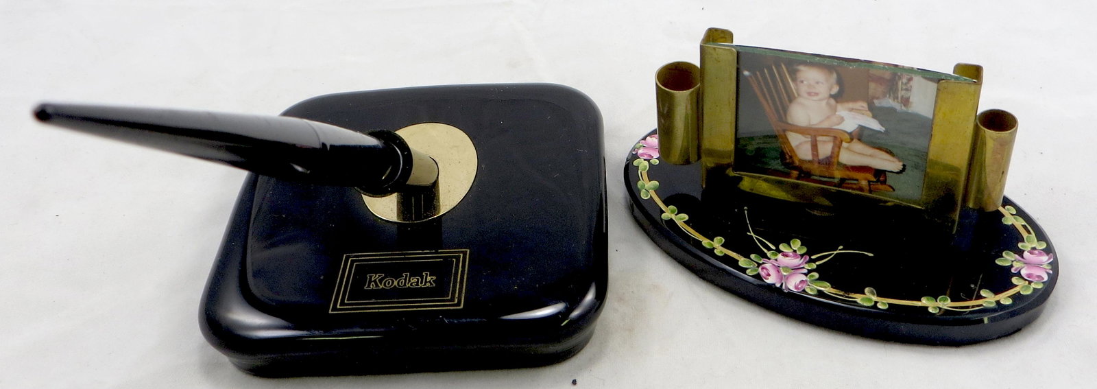 (2) VINTAGE DESK SETS: (1) "Kodak" Sheaffer 509H-44221, glass base, plastic pen with 14K nib; (1) enameled black glass base with double pen/pencil holder with picture frame; frame slightly bent, possibly replaced screw; lon