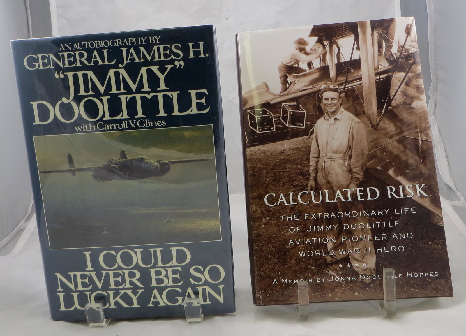 (2) WORLD WAR II BOOKS - DOOLITLE - SIGNED: (1) Glines, Carroll V.; "I Could Never Be So Lucky Again - An Autobiography by General James H. "Jimmy" Doolittle"; Bantam Books; 1991; retains dust jacket; [574 pgs]; front flyleaf, signed and dedica