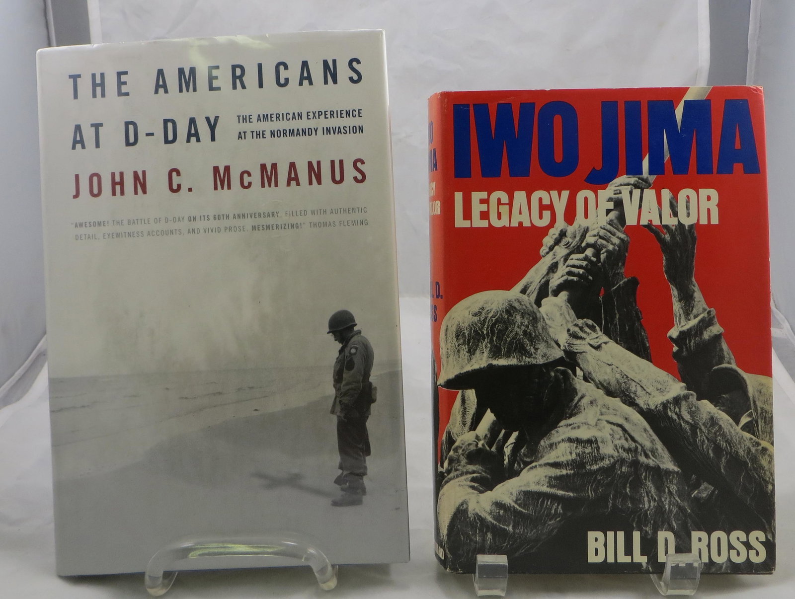 (2) WW2 BOOKS - EPIC BATTLES: IWO JIMA & NORMANDY: (1) Ross, Bill D.; "Iwo Jima Legacy of Valor"; New York, The Vanguard Press; 1985, possibly first edition; retains dust jacket; [362 pgs]; signed by participants on flyleaf and on half title page, "D 