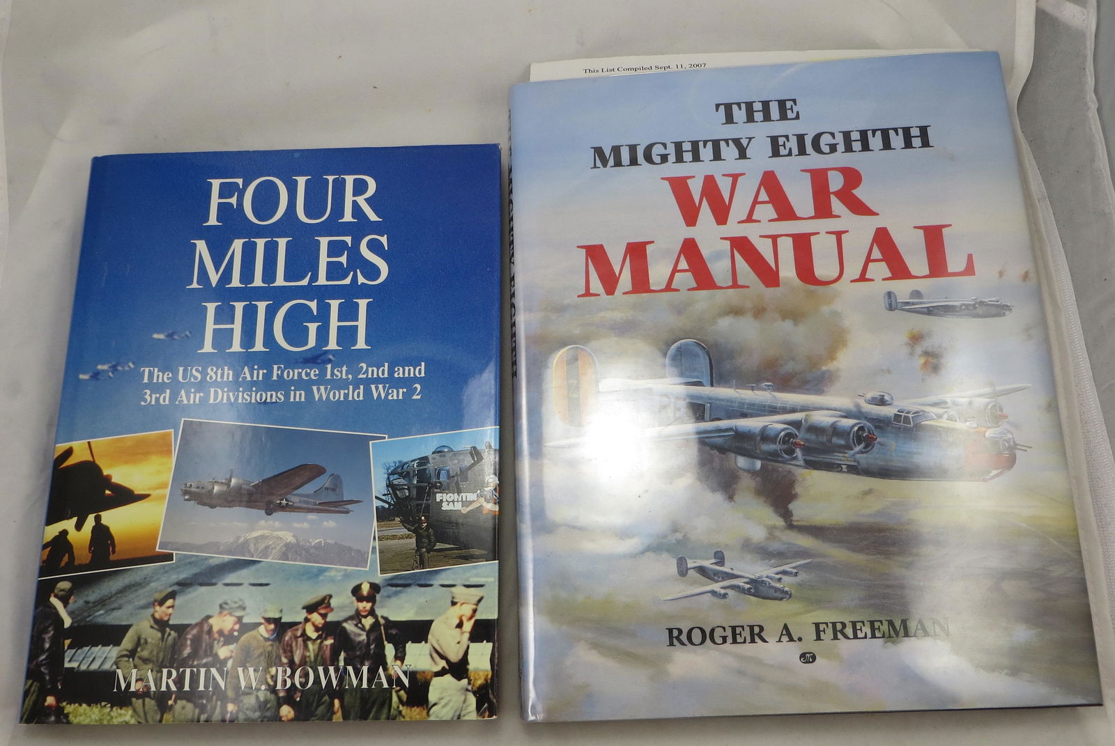 (2) WW2 BOOKS - US 8TH AIR FORCE THEME: (1) Bowman, Martin W.; "Four Miles High - The US 8th Air Force 1st, 2nd and 3rd Air Divisions in World War 2"; Patrick Stephens Limited, 1992; likely first edition; retains dust jacket; [240 pgs]; sig