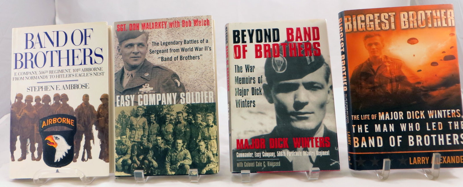(4) BAND OF BROTHERS / EASY COMPANY BOOKS, SIGNED: (1) Ambrose, Stephen E.; "Band of Brothers - E Company, 506th Regiment, 101st Airborne from Normandy to Hitler's Eagle's Nest"; Simon & Schuster; 1992; possible first edition; retains dust jacket; [33