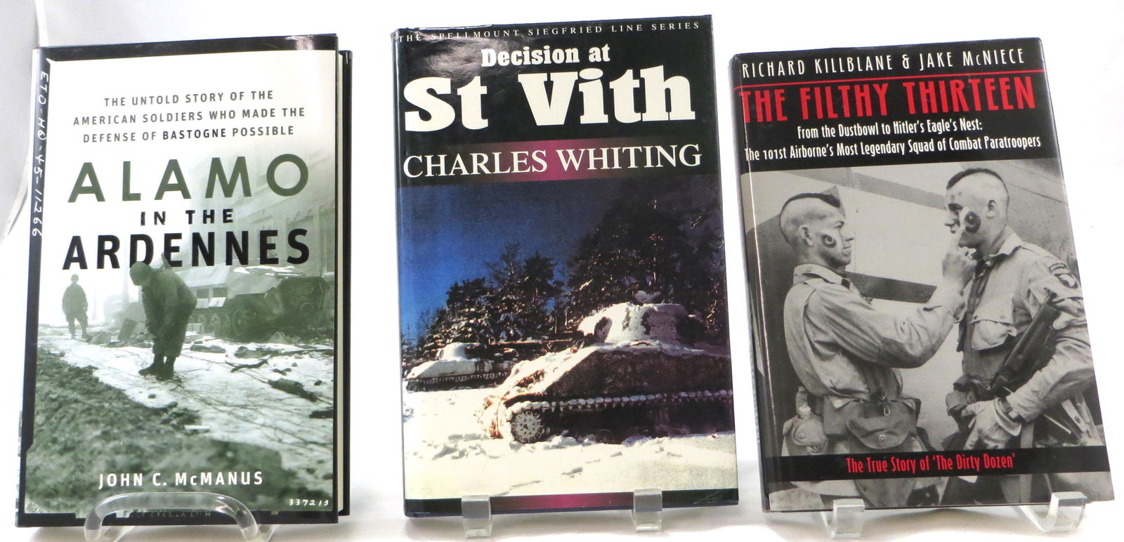 (3) WORLD WAR 2 THEME BOOKS: FILTHY 13, ARDENNES, ,: (1) Whiting, Charles; "Decision at St. Vith"; Spellount, Staplehurst; 2001; retains dustjacket; [261 pgs]; pasted in synopsis on title page, signed by the author; noted "see also page v."; bookplate s