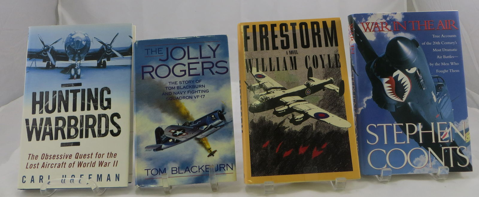(4)WORLD WAR II BOOKS - AIRCRAFT AND WAR: (1) "Firestorm" William Coyle, 1988; (1) "Hunting Warbirds", Carl Hoffman, 2001 1st ed.; (1) "War In The Air", Stephen Coonts, 1996; (1) " The Jolly Rogers" Tom Blackburn, 1989 VG- EX