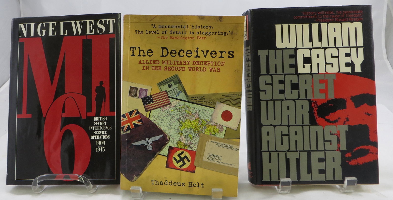 (3) WORLD WAR II BOOKS - INTELLIGENCE OPERATIONS: (1)"The Deceivers", Thaddeus Holt, 2007 Paperback; (1) "M I 6", Nigel West, 1983; (1) "The Secret War Against Hitler", William Casey, 1988; 2 with dust jackets, probably first editions, F - VG
