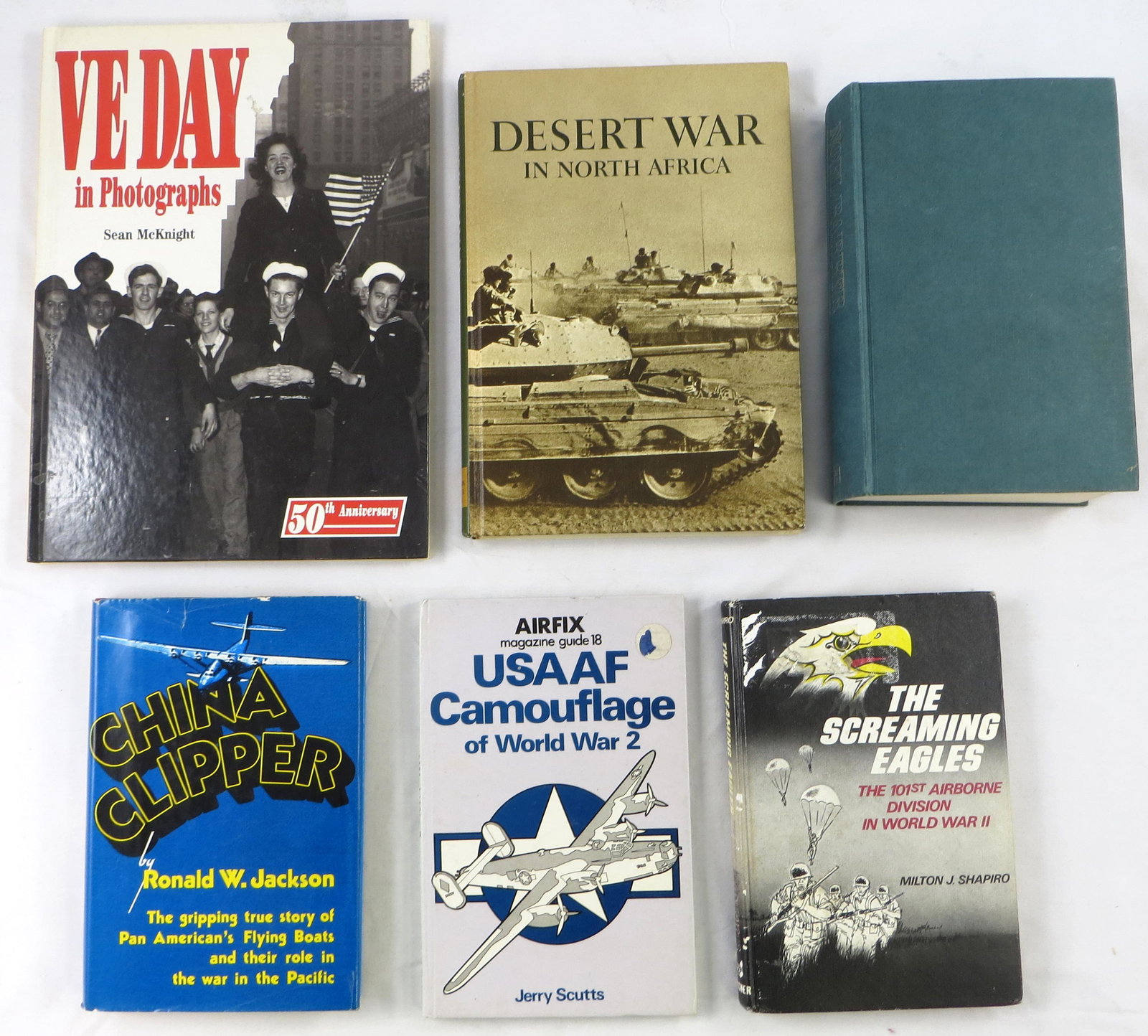 (6) WW II BOOKS - AIRCRAFT, DESERT WAR, MISC: (1) "China Clipper" Ronald W. Jackson, 1980 1st. Ed.; (1) "USAAF Camouflage of World War 2", Jerry Scutts, 1976; (1) " The Screaming Eagles" Milton J. Shapiro, 1976; (1) " A Farewell To France" Noel B