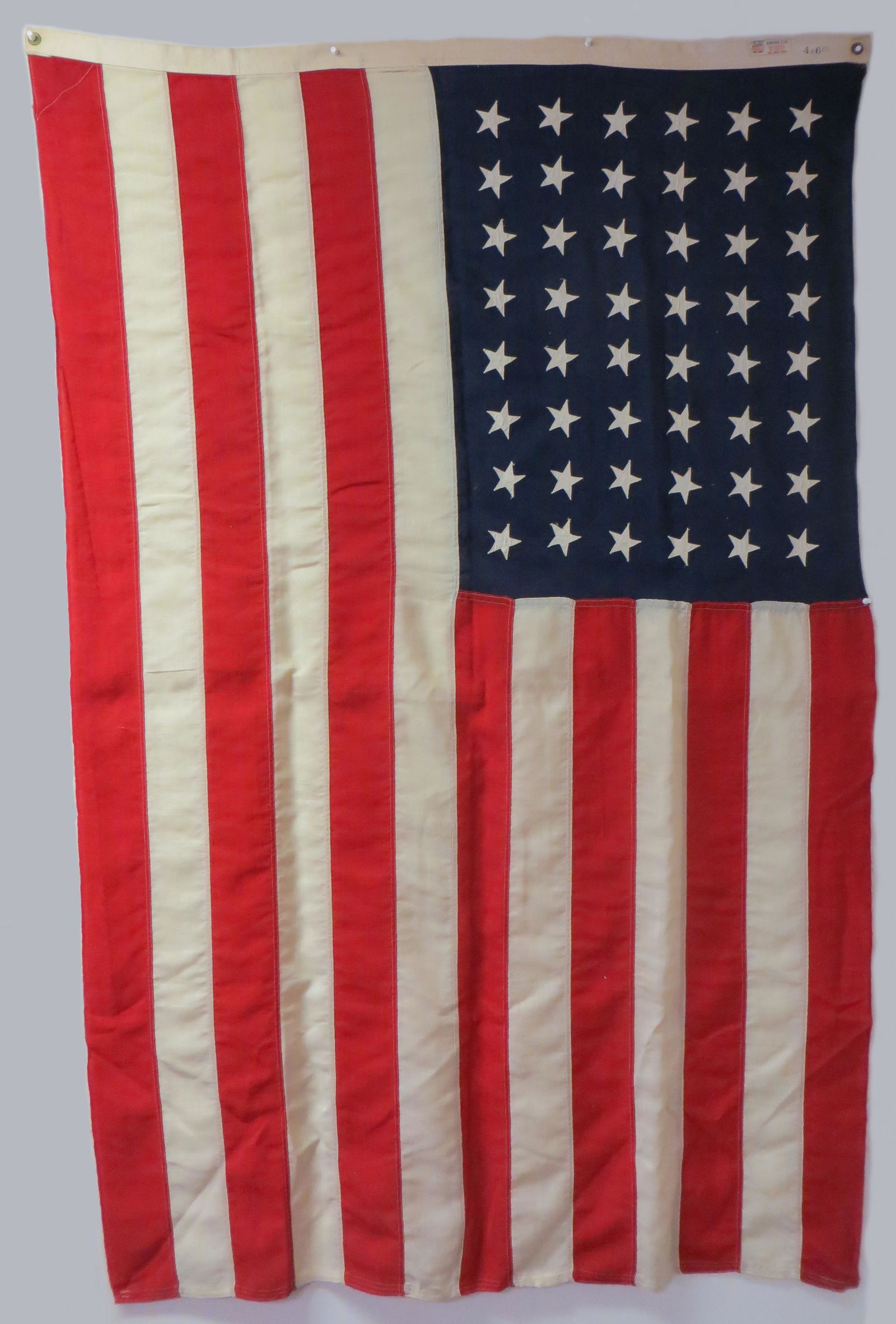 48 STAR AMERICAN FLAG: Bunting wool; stitch-applique stars; purported to have flown over the White House; 4' x 6', VG-EX
