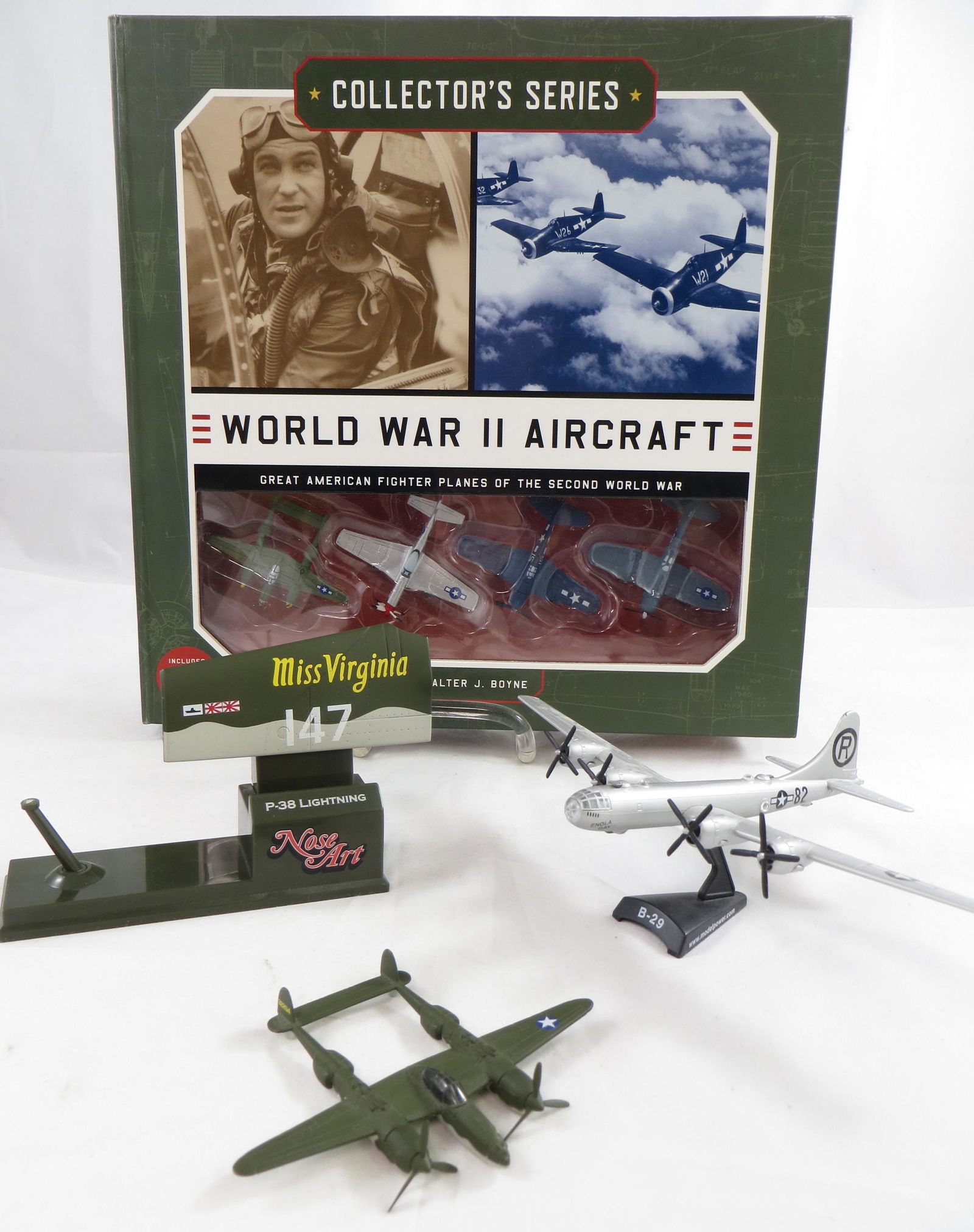 (3) WWII AIRPLANE MODELS: (1) B-29 Enola Gay, scale 1:200 metal; (1) Corgi "Miss Virginia" P-38 Lightning, metal with plastic base, plane has broken off the stand; (1) WWII Aircraft Collector Series byy Walter J. Boyne includi