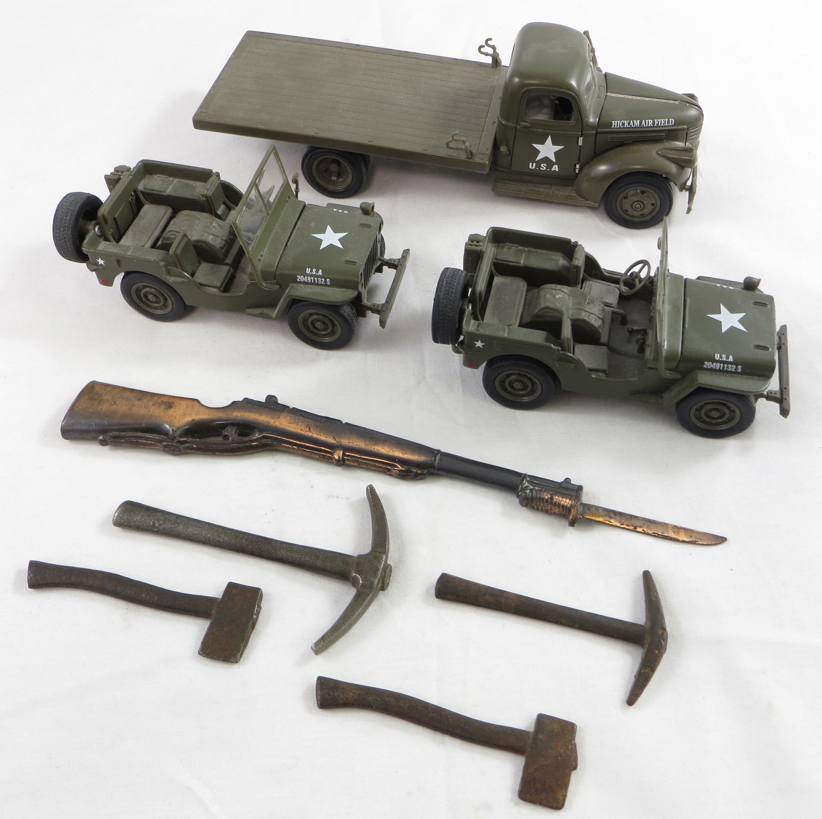 (8) TOY ARMY TRUCKS, TOOLS & RIFLE: (2) Jeep Willys, (1) 1941 Chevy Flatbed Truck; (1) metal Minuteman rifle; (4) cast iron axes; longest L-9", VG-EX