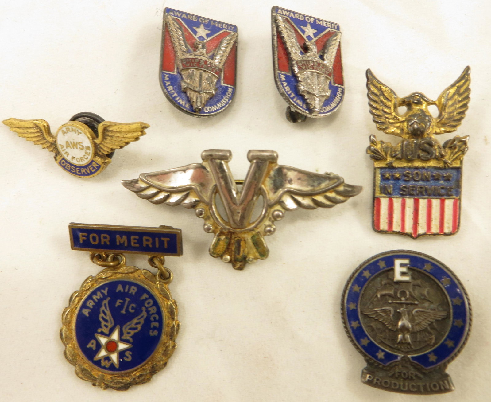 (6) ASSORTED MILITARY HOME FRONT PINS: (1) Army Airforce Observer Pin; (1) Army Airforce Merit Award, sterling; (1) Son in Service pin, sterling, Coro; (1) E-Award for Production, pin, sterling; (2) Maritime Commission Award of Merit pins,
