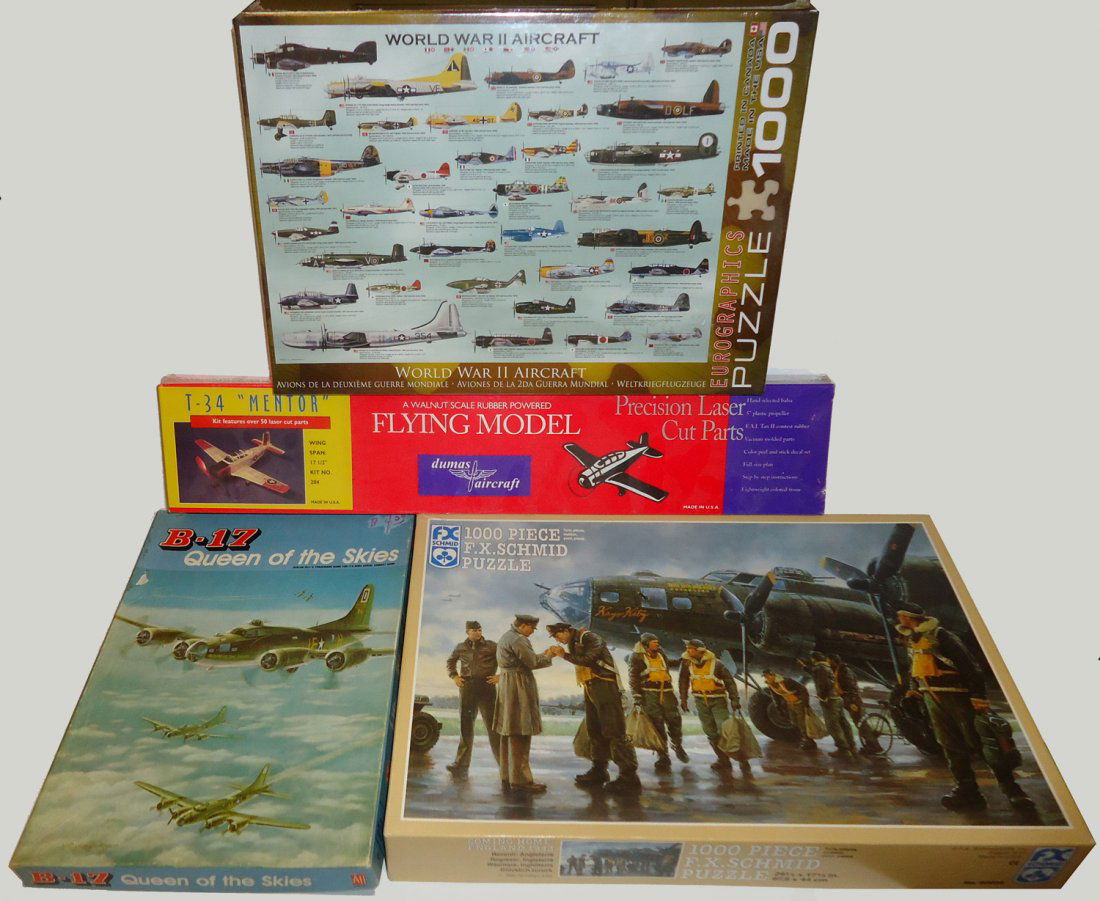 (4) PCS. WWII PUZZLES, FLYING MODEL & GAME: (1) WWII Aircraft puzzle - sealed, never opened, 1000 pcs; (1) "Coming Home: England 1943" FX. Schmid puzzle, 1000 pcs; (1) T-34 "Mentor" Dumas aircraft model kit, never opened; (1) Vintage B-17 "Quee