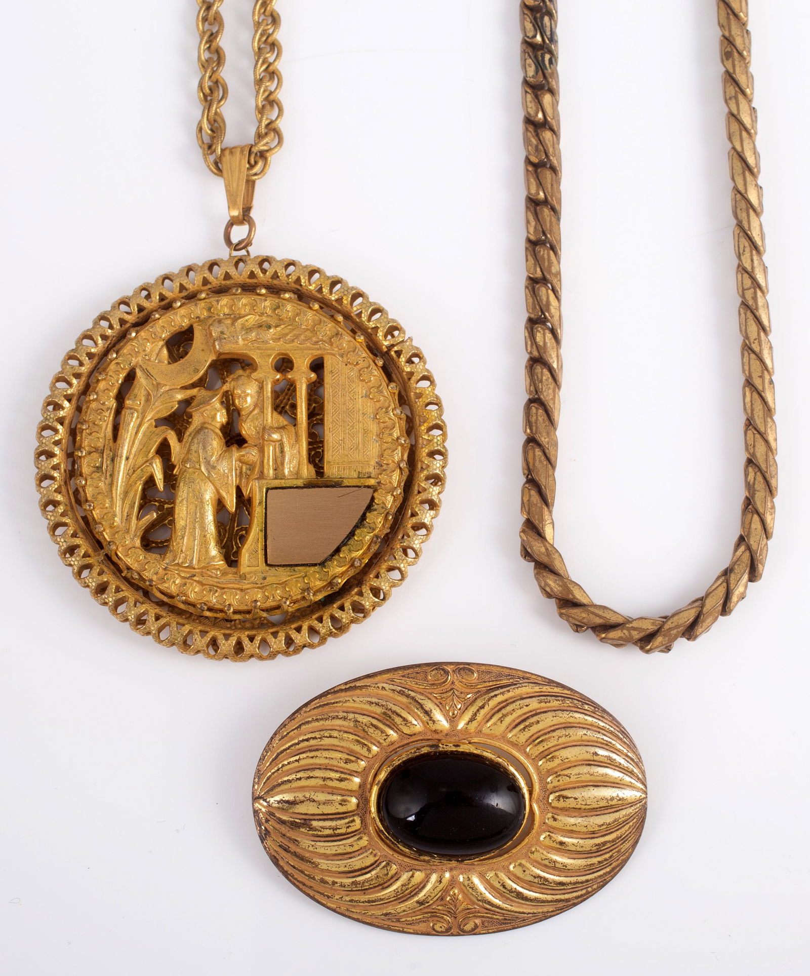 MIRIAM HASKELL JEWELRY (3) PIECES: Goldtone; (1) chain necklace; (1) necklace with medallion drop, engraving plate on medallion may or may not be original; (1) brooch with black center; some finish loss; longest 28", G-VG