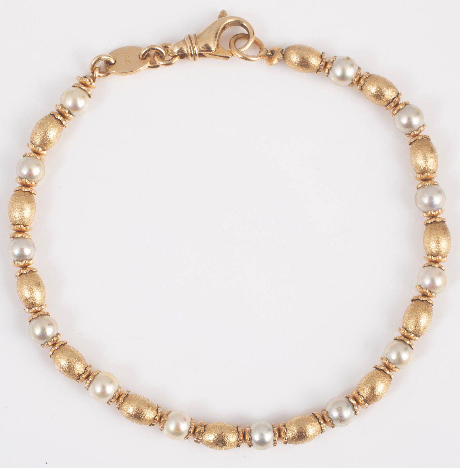 14K YELLOW & WHITE GOLD BEAD BRACELET: Alternating beads, lobster catch; Italy; 7" long; 8.2 grams