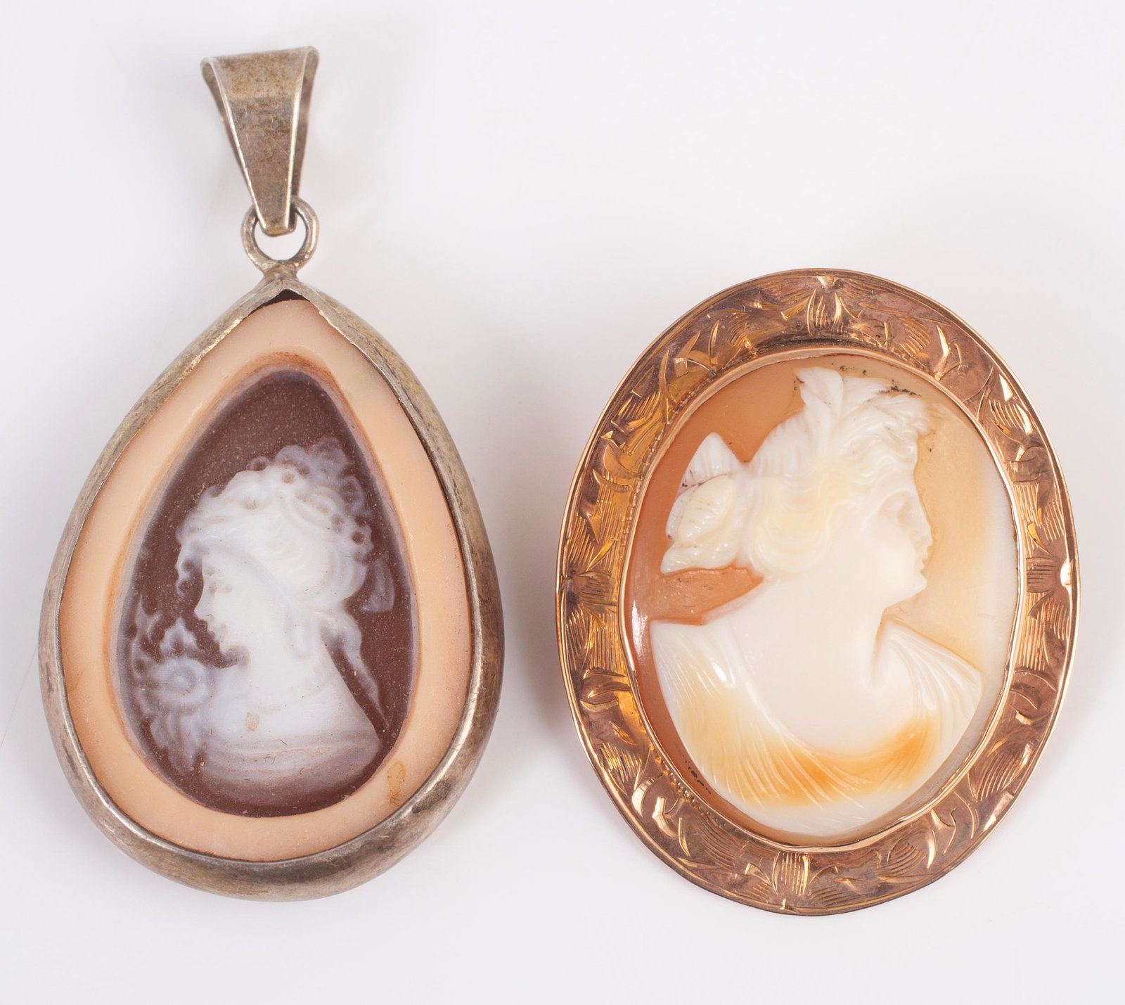 (2) PCS. CAMEO JEWELRY: (1) cameo brooch, set in 10K yellow gold, pin back with folding bail L-1 1/2"; (1) pendant with unusual carved cameo, sterling bezel, L-1 1/2"