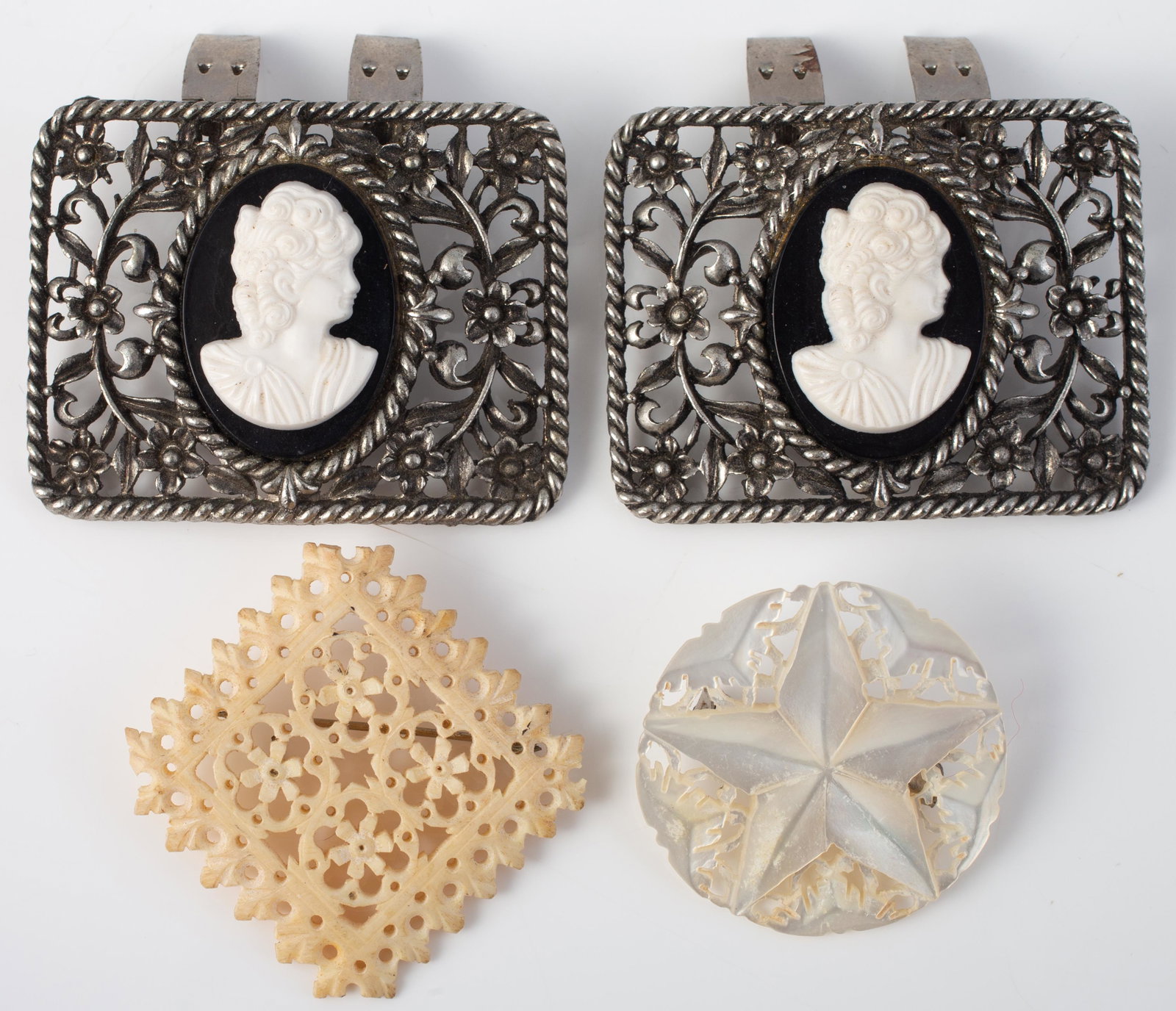(3) PCS. VINTAGE JEWELRY: (1) pair shoe clips, silver tone metal with plastic cameos, L-2 1/8"; (1) openwork bone brooch, L-1 3/4"; (1) mother of pearl carved star pin, Dia.-1 1/2";