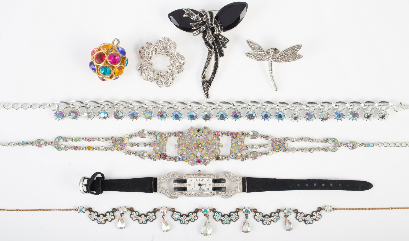 (7) PCS. RHINESTONE, ETC. COSTUME JEWELRY: Includes: (1) goldtone jewel-tone rhinestone ball drop; (1) silvertone dragonfly pin; (1) silvertone circle pin with marcasite type stones; (1) quartz Pedre watch (untested) with rhinestones and black