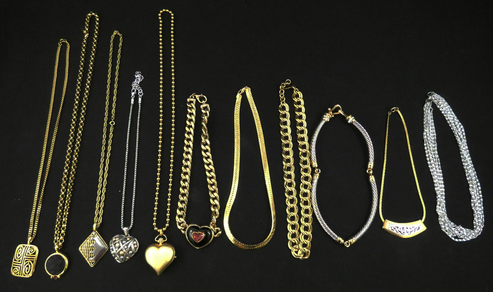 COSTUME NECKLACES (11): Silvertone and gold tone; (3) with heart pendants; (1) has intaglio pendant; normal wear; longest L-30", G-VG