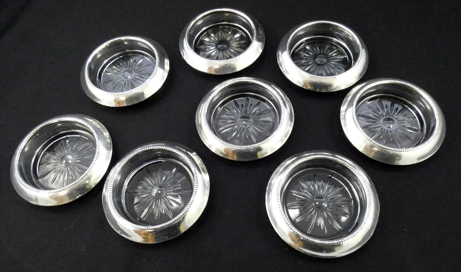 SET OF (8) STERLING RIMMED COASTERS: Glass with sterling rims, marked Frank M. Whiting & Co. Sterling 04 Pat Pending, beaded inner edge, minor wear, Dia.-4"; VG+