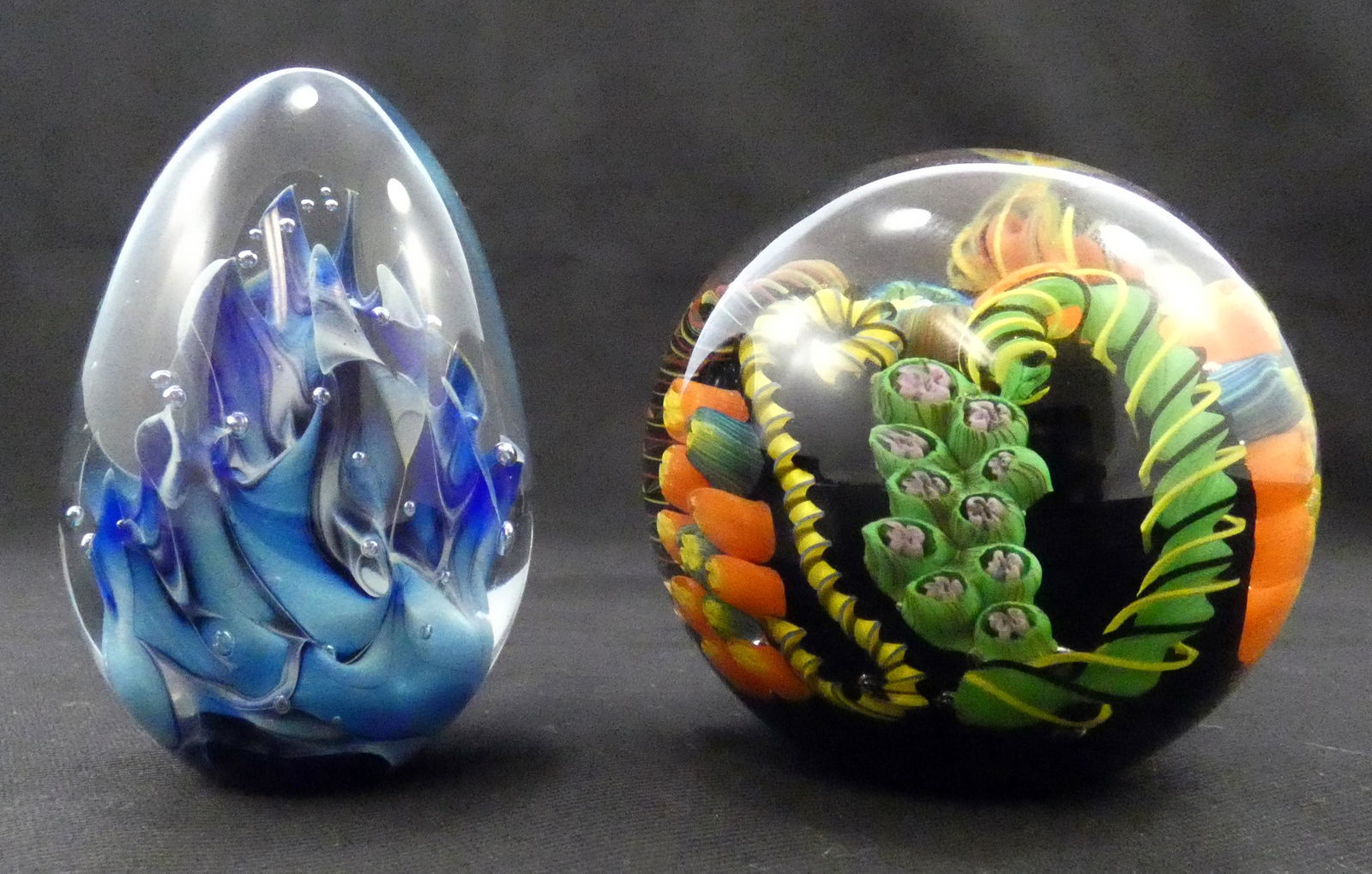 (2) SIGNED C. WALTERS ART GLASS PAPERWEIGHTS: (1) blue egg-shaped dated '93; (1) round caned glass, dated '13, largest Dia.-3", EX