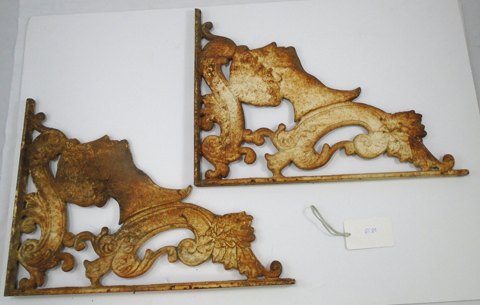 PAIR CAST IRON CLASSICAL THEME WALL BRACKETS: Painted cast iron; Greco-Roman man's head in profile, scroll design; retains some paint; surface rust and overall oxidation; 16 1/2" x 12 1/4", G