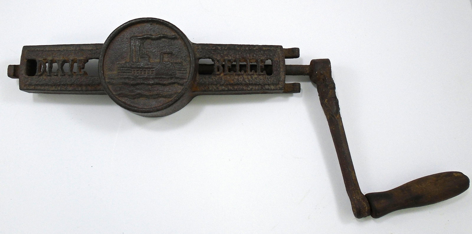 DIXIE BELLE ICE CREAM CRANK: Cast iron hand crank for Dixie Belle ice cream maker; steamship logo central; handle appears to have been repaired/welded; surface rust; L-12"; including handle L-17", G