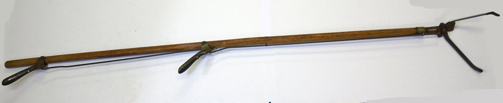 COUNTRY STORE SHELF PICKER / GRABBER: Wooden handle with metal pincers and levers; oxidation to metal pices; wear to shaft; (2) levers; L-50", G