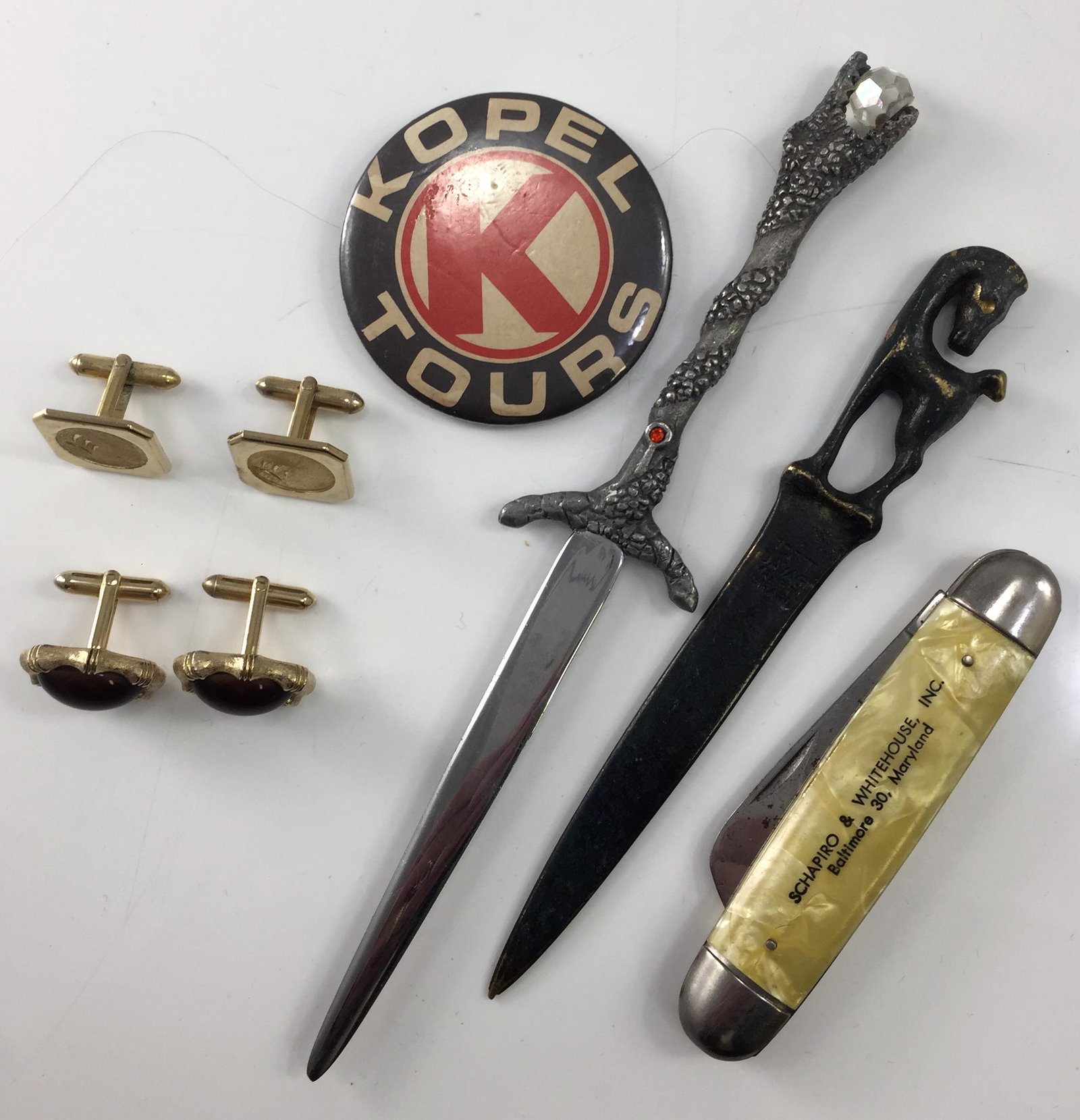 CUFFLINKS, PEN KNIFE, LETTER OPENERS, ETC.: (2) pair cufflinks, 1-pair Swank with tigereye stones; (1) advertising pen knife - Schapiro & Whitehouse Baltimore, MD; (2) letter openers, 1-made in Israel, bronze; advertising button for Kopel Tours