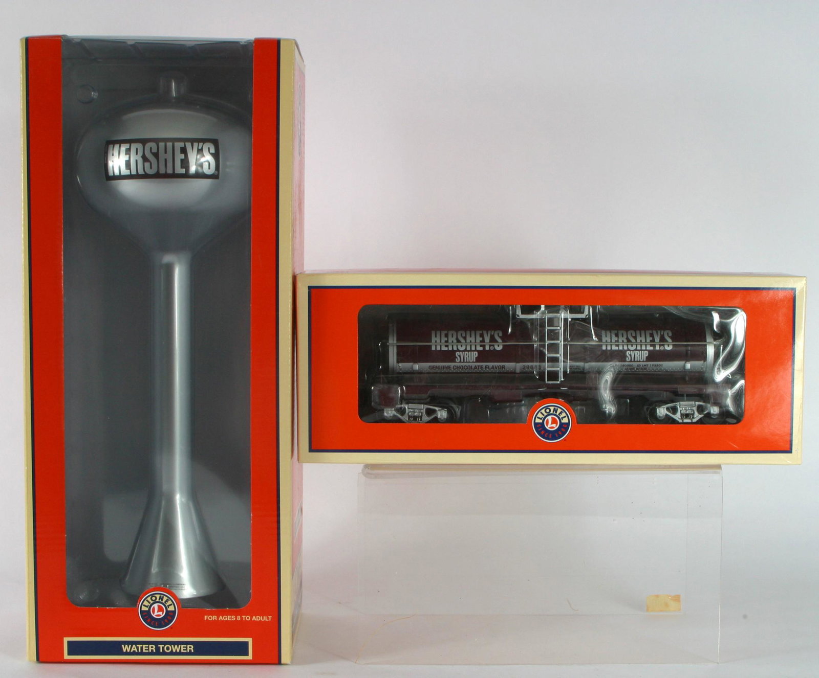 LIONEL HERSHEY'S WATER TOWER & TANK CAR: Original boxes; O scale; (1) water tank, plastic 6-37158; (1) tank car, die-cast metal, 6-29643; longest box 15 1/2",