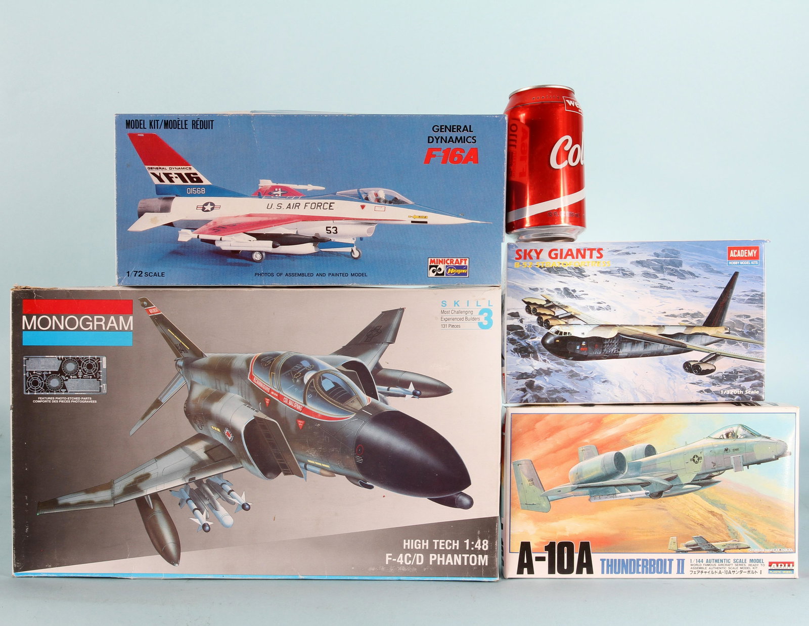 (4) WARPLANE MODEL KITS in ORIGINAL BOXES: (1) Monogram F-4 C/D Phantom 1/48 kit, all sealed parts on trees, comes with metal etched parts; (1) minicroft F-16A 1/72 scale kit; most parts removed from trees; appears complete; (1) ARII A-10A Thu