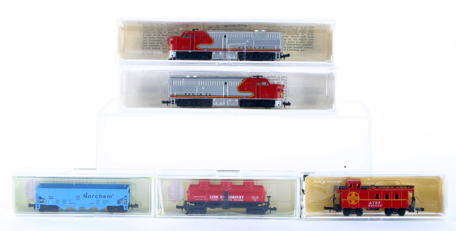 N SCALE ENGINE & CARS - ORIGINAL BOXES: Metal and plastic construction, includes: (1) Alco Santa Fe 7534, (1) Alco Santa Fe FA2; (2) Model Power freight cars: Lion Oil Company tanker and Norchem Hopper; (1) Model Power ATSF caboose #999005;