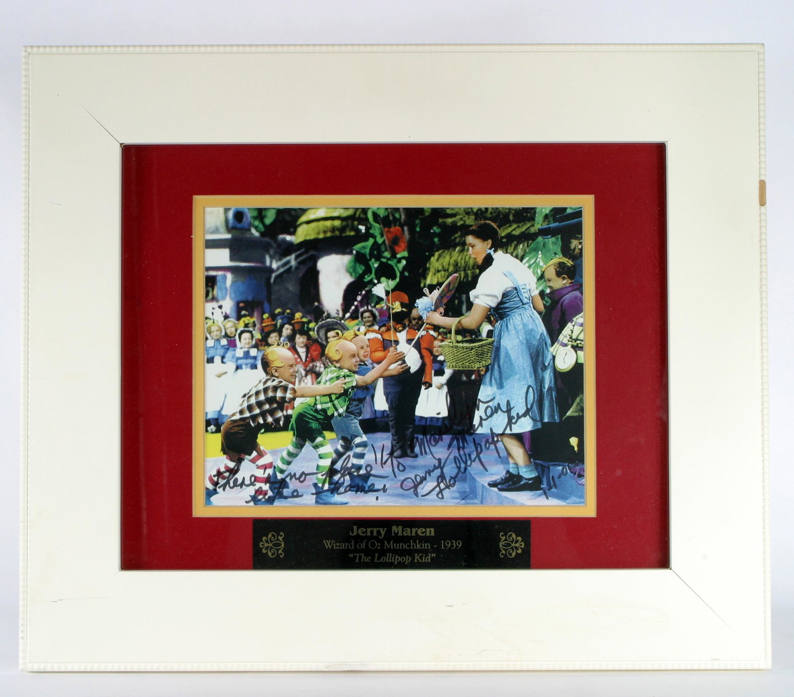 WIZARD OF OZ MUNCHKIN COLOR PHOTO: Color photo, possibly lobby card re-print; personalized hand-written message: "To Marilyn - Jerry Maren Lollipop Kid 1-1-05", plaque on frame: Jerry Maren Munchkin 1939 "The Lollipop Kid"; framed; ima