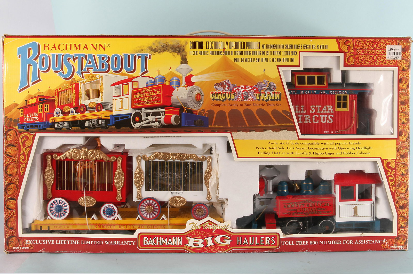 BACHMANN ROUSTABOUT EMMETT KELLY CIRCUS TRAIN-BOX: Boxed G scale Bachmann Roustabout Emmitt Kelly Jr. complete ready to run electric train set; has 12 curved and 2 piece strait track; comes with train engine, flat car with giraffe and hippo cages and