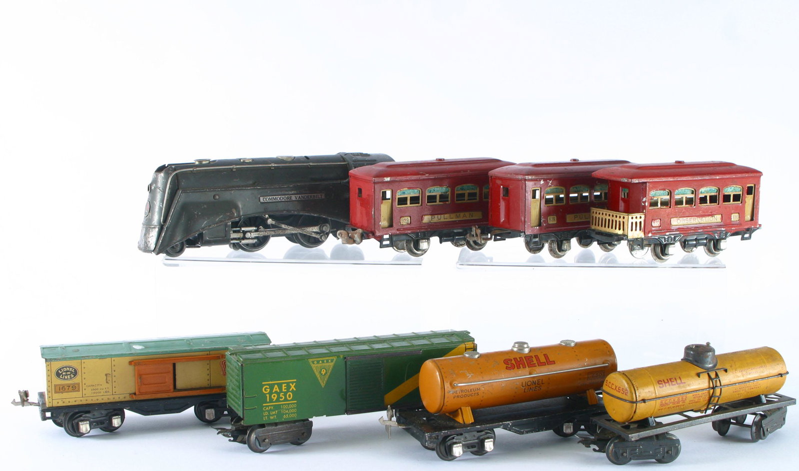 LIONEL ENGINE & CARS, ETC. (8): O gauge; metal and tin litho; Engine No. 265-E Commodore Vanderbilt, missing grill on front of engine and switch on top; (3) Pullman cars: 629 and 630 (repainted) and (1) 629 with original paint; (2) 
