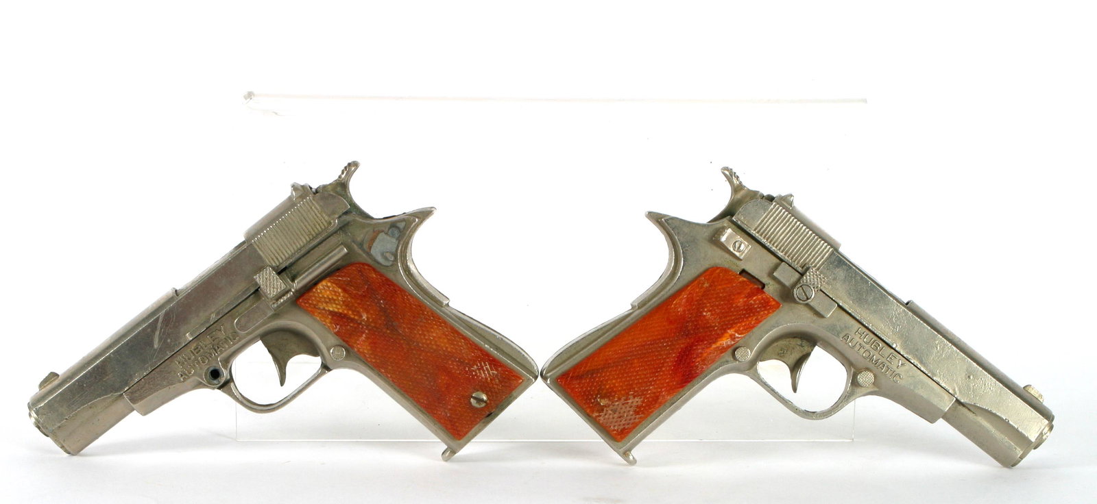 (2) VINTAGE HUBLEY AUTOMATIC .45 CAP GUNS: Retains original grips, 4 1/2" x 6",