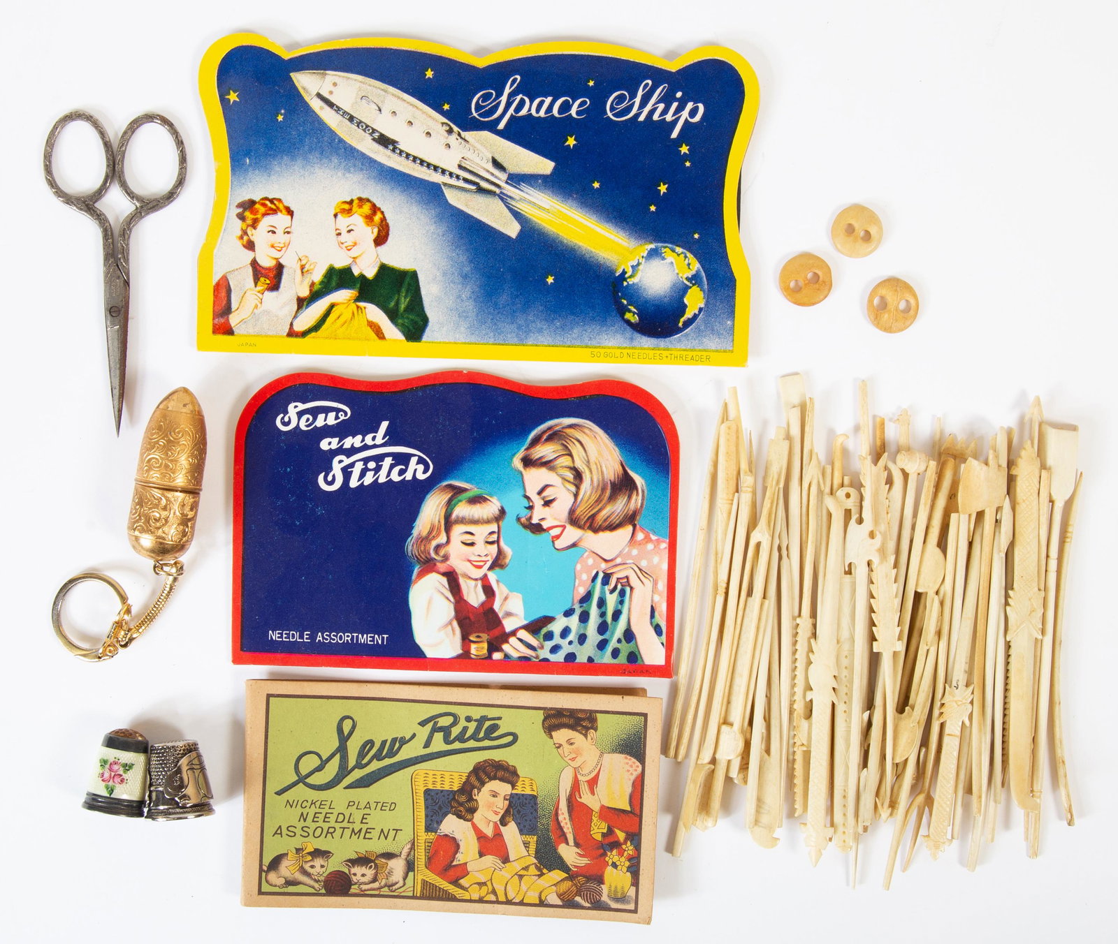 VINTAGE SEWING IMPLEMENTS (60+/-): Includes (50+) carved bone tools, appears to be game of Jackstraws; (3) thimbles 1-enameled silver; (1) pair scissors, (3) needle cards ,complete; a few minor breaks on bone implements; longest 6", G-