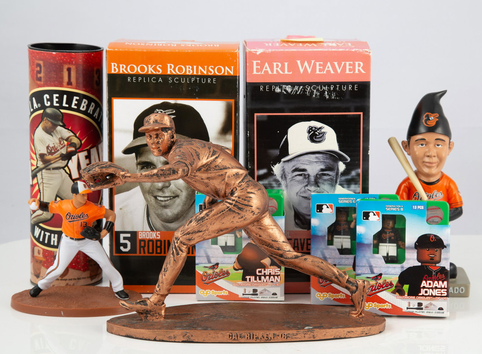 (9) ORIOLES COLLECTIBLES - FIGURAL, ETC.: Includes: (1) Earl Weaver replica sculpture in original box (box has corner damage); (1) Brooks Robinson Replica Sculpture in original box; (1) Cal Ripken Jr. resin sculpture (bronze color); (1) Manny