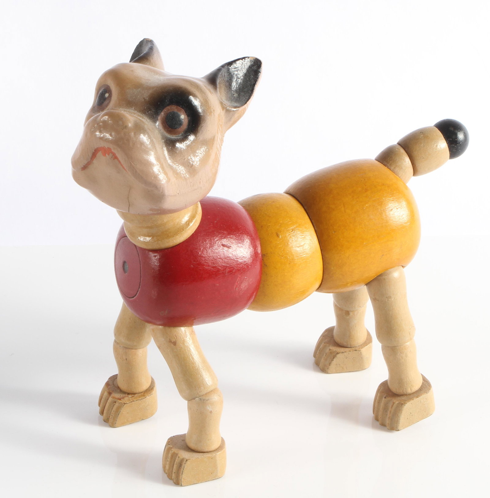 CAMEO TOY KALLUS WOOD DOG TOY: Strung wood with composition head; French bulldog; missing collar (likely "Goldie" dog); light wear and abrasions to tips of ears, small crack below mouth; L-5", G-VG