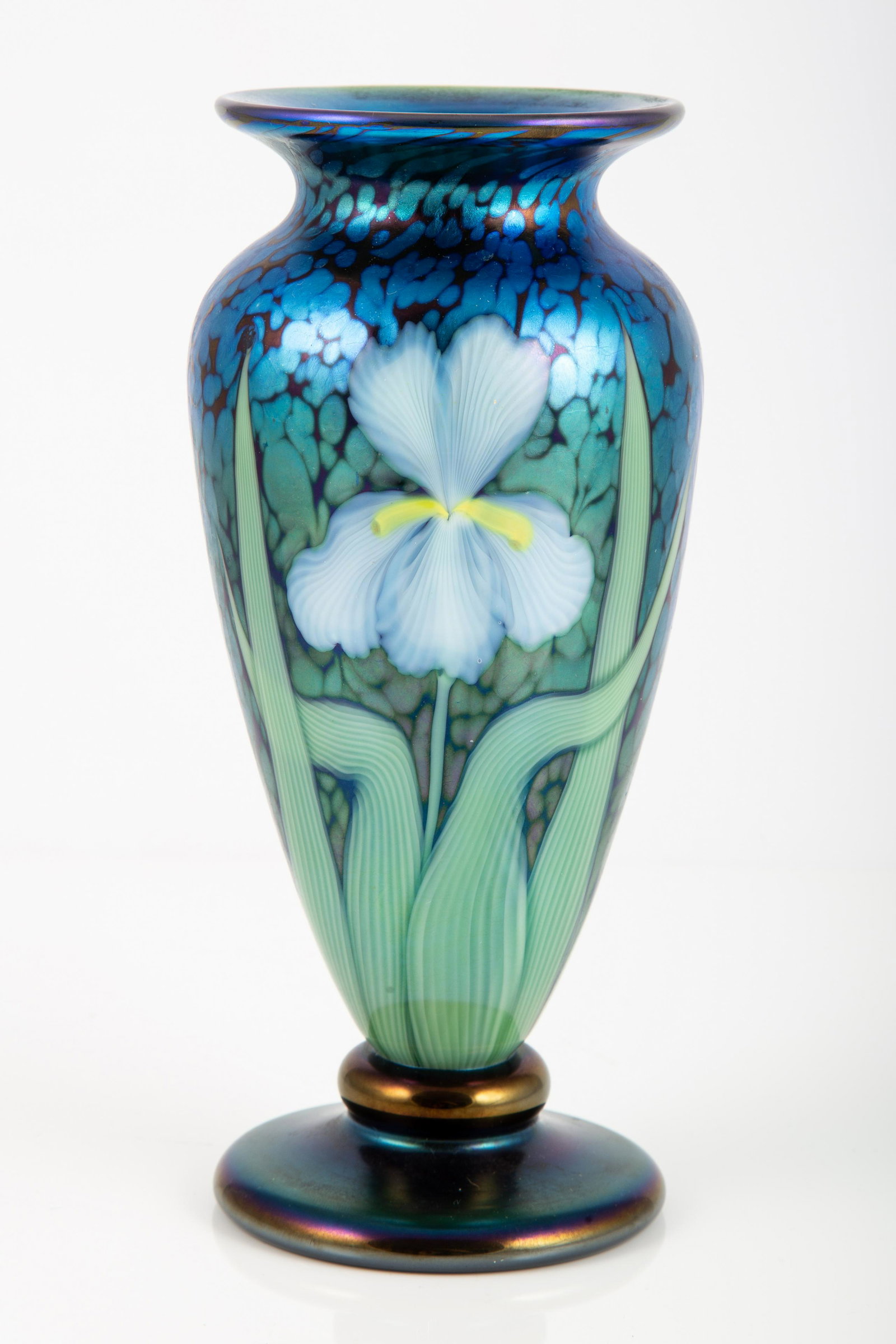 ORIENT & FLUME ART GLASS VASE - CARTER: iridescent blue vase with white iris motif, bottom signed: Orient & Flume Bradley Carter ROO89CZ, H-8", largest Dia.-3 1/2", overall EX+
