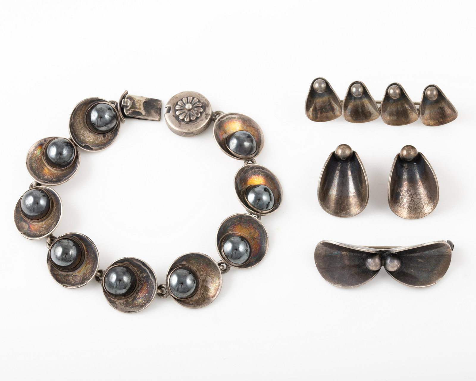 (4) PCS. DANISH STERLING N. E. FROM: Niels Erik From design jewelry, including, (1) pin, L-1 1/2", (1) pin L-1 3/4", (1) pair clip L-3/4"; (1) bracelet, L-6 1/2"; [1.38 ozt total], overall age appropriate wear; VG+