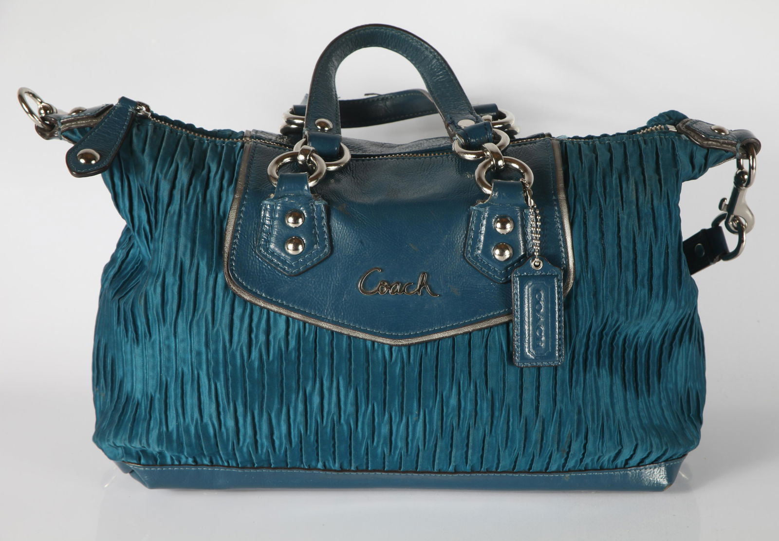 COACH "ASHLEY" HANDBAG - OCEAN BLUE: Gathered sateen fabric and patent leather; interior lined with grey fabric, interior zippered pocket and two open pockets; retains hang tag; tag inside numbered: H1282-F20084; leather edging worn on o