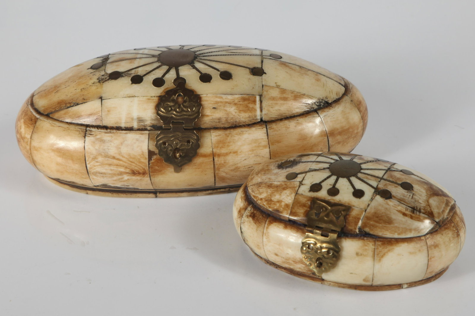 (2) BONE COVERED TRINKET BOXES: Oval form, velvet lined, brass inlay with brass hasp; likely contemporary; L-6" - 3 3/4", VG-EX
