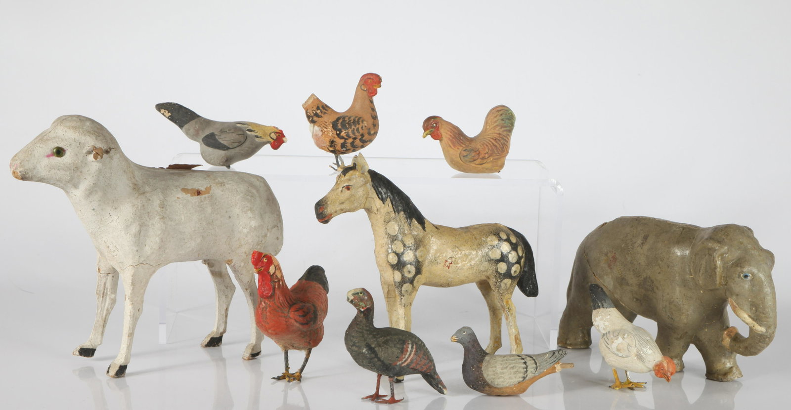 ANTIQUE COMPOSITION BARNYARD, ETC. ANIMALS (10): Includes: turkey (wear/losses to head), (1) rooster (head wear/loss), (4) hens (losses, wear, feet loss to two), (1) pigeon (tail and foot loss), (1) horse (cracks but apparently complete), (1) large 